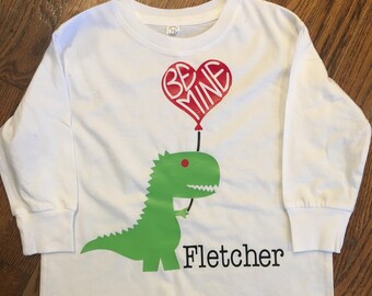 Dino with heart balloon