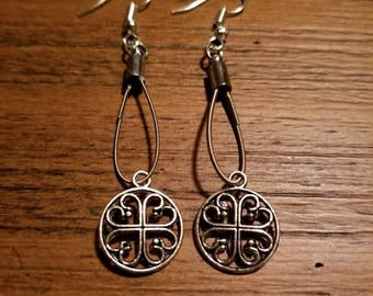 Guitar string earrings with embellishment