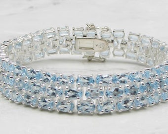 Items similar to CLOSEOUt Half Off Beautiful Blue Topaz Sterling Silver
