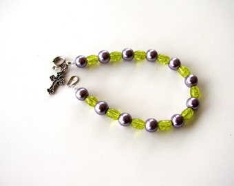 Pearl bracelet. Green bracelet. Purple bracelet. Lavendar bracelet. Charm bracelet. Purple and green bracelet with cross charm