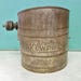 One Cup Kewpie Sifter ~ Embossed Kewpie ~ 3 1/2 Inches High ~ Kitchen Tested Condition
