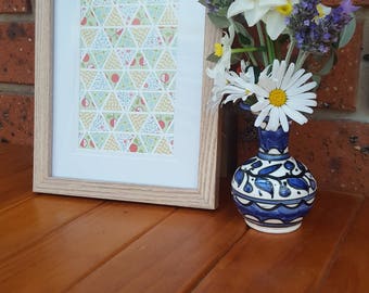 Yellow, blue, green triangles on canvas