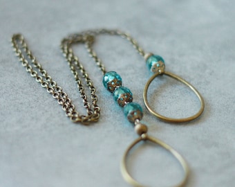 Tie necklace mottled blue beads, silver Sterling and bronze