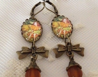 Fairy Rabbit cameo earrings from orange flowers.