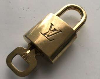 Authentic Preowned Louis Vuitton brass lock and key #303