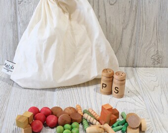 Play wood food, pasta and veggies, salt and pepper. Pretend kitchen must have!