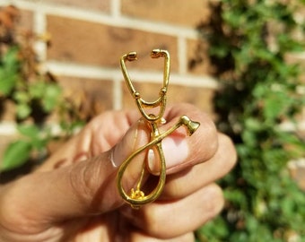 Simple gold stethoscope nurse pin. Nursing pinning ceremony pins. Nursing Graduation gifts! Nurse LPN pins. Medical lapel pin. Boutonniere