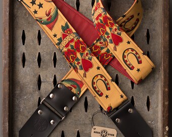 Tattoo Series 2" tan fabric on red leather "Amor" guitar strap