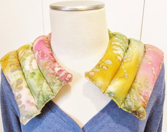Rice hot or cold neck and shoulder wrap. Soothing, relaxing, great for stiff necks, muscle pain and tension. Fits well, won't fall off.