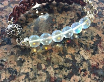 Half leather, half genuine natural moonstone on silver wire, with magnetic clasp, this style is so comfortable, you'll forget its on!