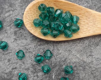 Glass beads, beads faceted 4 mm, dark green, glass spacer beads