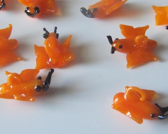 Set of 25 glass pendants in the shape of butterflies - orange and black
