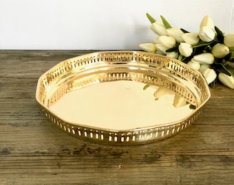Round Brass Serving tray with cutout edging and floral handles