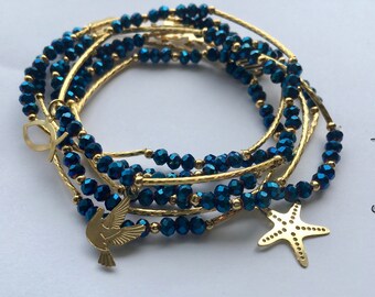 Metallic blue crystal beaded bracelet set (7) with gold plated charms - Semanario pulseras de color azul metalico con dijes chapa de oro