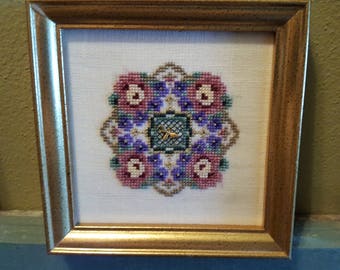 Primrose Path - finished cross-stitch, pattern by Just Nan
