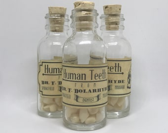Faux curiosity: resin dentures in glass bottle
