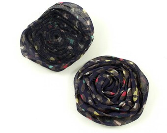 Synthetic purple fabric flower printed approximately 8cm.