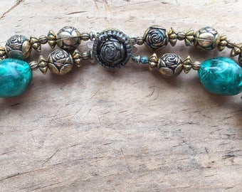 Vintage metal gold copper tone rosettes and teal/blue/green beads double strand necklace with rosette clasp