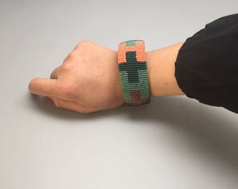 coral and green handmade beaded bracelet