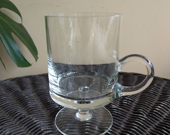 Glass pedestal footed mug with handle
