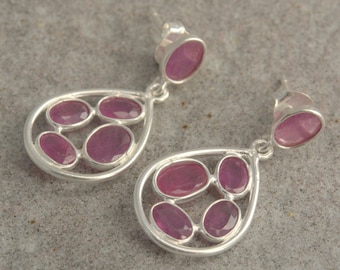 Sterling silver earrings with faceted ruby