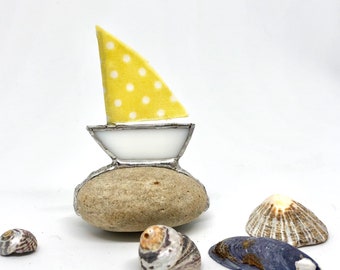 Yellow polkadot sailing boat