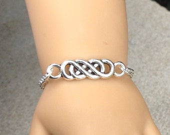 My doll and me matching Celtic infinity symbol silver plated bracelets for girls and their American Girl doll and/or other 18" dolls
