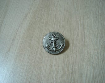 silver metal button with anchor