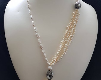 Freshwater pearl with marquasite and rhinestone beads and fresh water pearl tassel. Lenght 17"