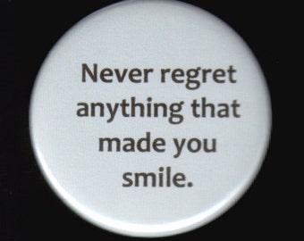 Never regret anything that made you smile. Pinback button or magnet