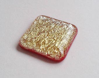 Square cabochon, red and gold dichroic fused glass.