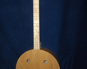 Four stringed round guitar