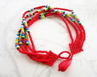 Bracelet weaved in seed type "Maasai", red and multicolor