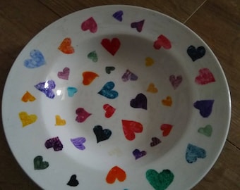 A hand painted white ceramic bowl