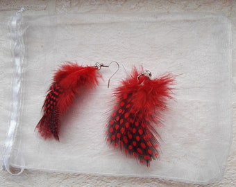 Red feather earrings