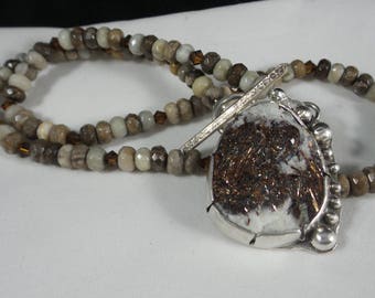 Astrophyllite Cabochon in a handmade sterling setting on a jasper beaded necklace