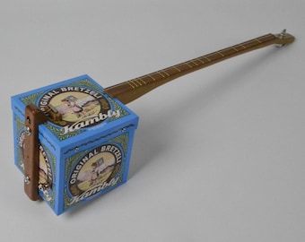 A Lovely Swiss Bretzeli Biscuit Tin Electro Acoustic Canjo, One String Guitar, Diddley Bow, Cigar Box Guitar, Cookie Tin Guitar, Electric