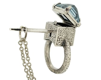 Mystic Chamber Ring - Sterling silver poison ring with topaz, sapphires and accompanying key.