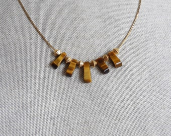 Tiyi 24K gilded necklace and tiger eye beads