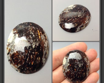 Astrophyllite cabochon 38x31x7mm