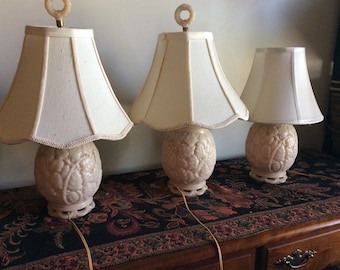 Three antique lamps