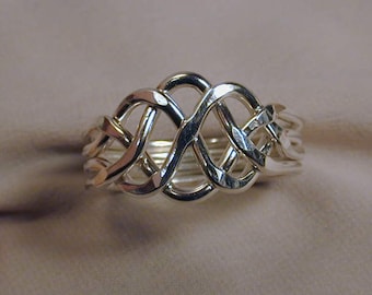 4pc. puzzle ring Sterling Silver