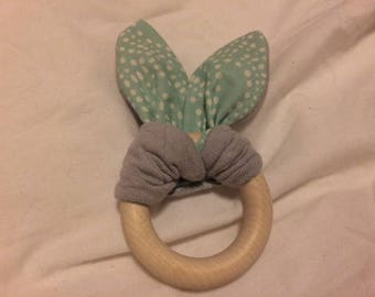 Organic rattle with different textures in fabric bunny ears