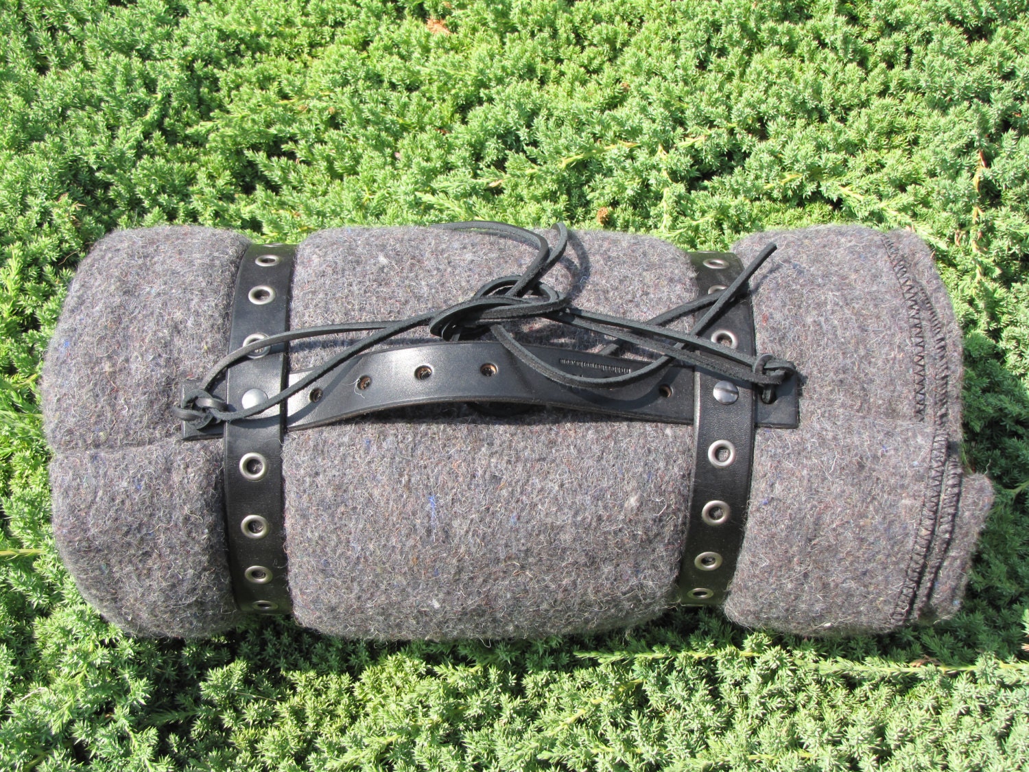 Gray Blanket Roll with brown Black leather eyelet straps for