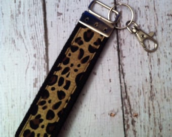 Leopard print key fob wristlet on black cotton webbing with swivel lobster clasp