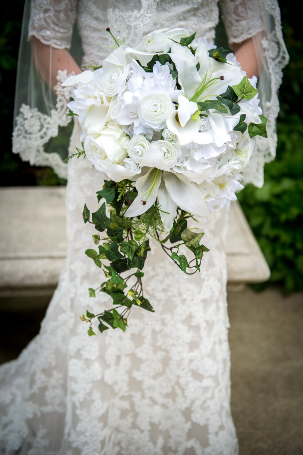 Luxurious fern and ivy cascade bouquet lilies ranunculus Luxurious fern and ivy cascade bouquet lilies ranunculus