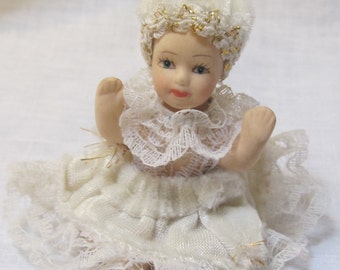 vintage doll with white velvet dress
