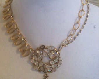 Necklace of repurposed vintage pieces in gold tone.