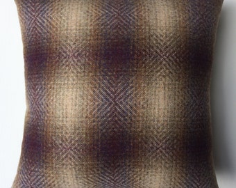 Handmade cushion in purple and cream checked fabric.
