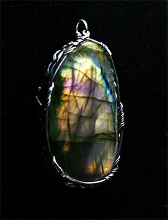 Labradorite pendant wrapped in a sterling silver Celtic design